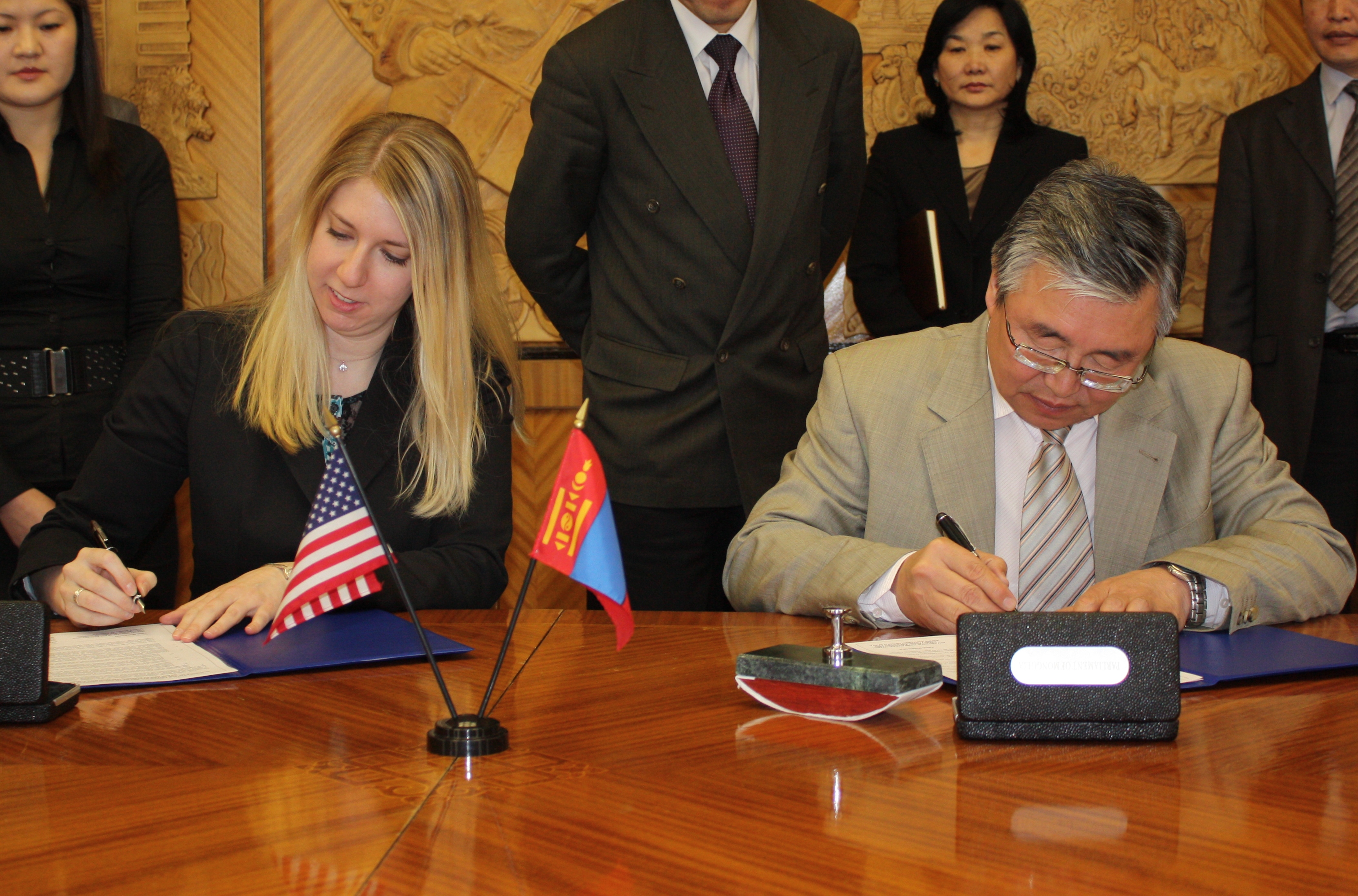 Ts. Sharavdorj, Mongolian Parliament General Secretary, signs the memorandum of understanding with Tina Mufford, IRI's Deputy Director for Asia